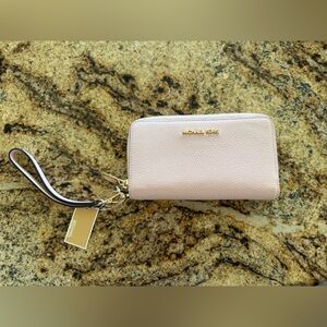 Michael Kors Powder Blush Leather wristlet. New with tags